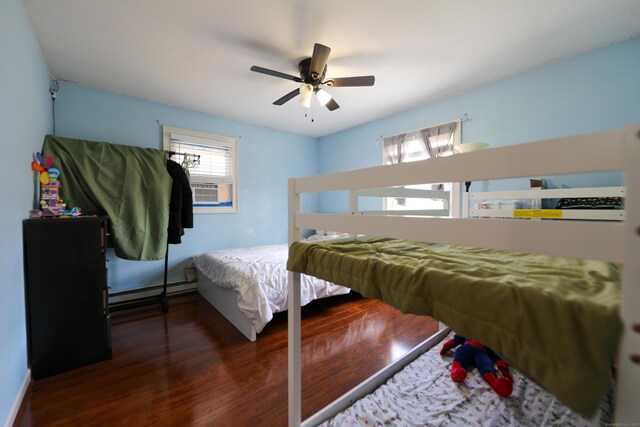 50 Dean Rd, New Milford, CT 06776 - bedroom featuring wood finished floors, a baseboard radiator, a ceiling fan, and cooling unit