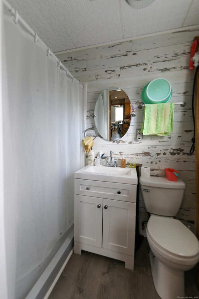 50 Dean Rd, New Milford, CT 06776 - bathroom featuring vanity, wood finished floors, a shower with shower curtain, and toilet
