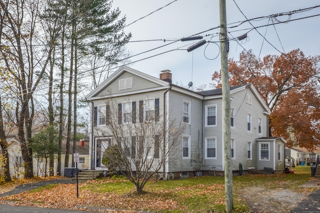 view of front of house with a chimney