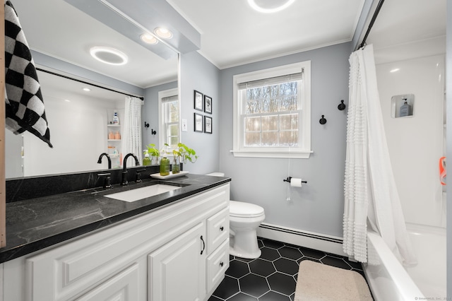 bathroom with vanity, crown molding, toilet, and a baseboard heating unit