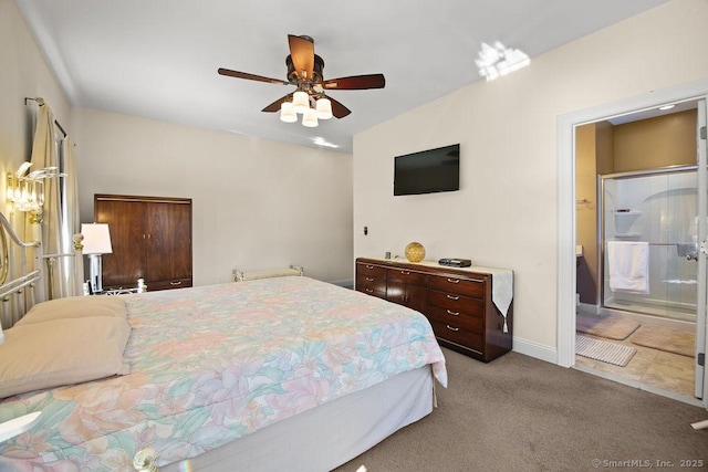 bedroom with light carpet, a ceiling fan, baseboards, and connected bathroom