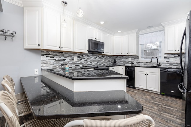 kitchen with black appliances, decorative backsplash, and white cabinets