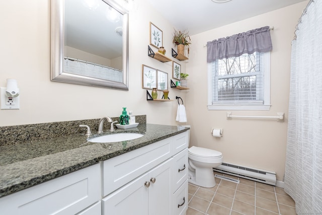 bathroom with visible vents, toilet, tile patterned floors, vanity, and a baseboard heating unit