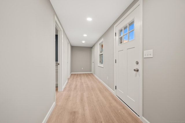 interior space with light wood-style floors, baseboards, and recessed lighting