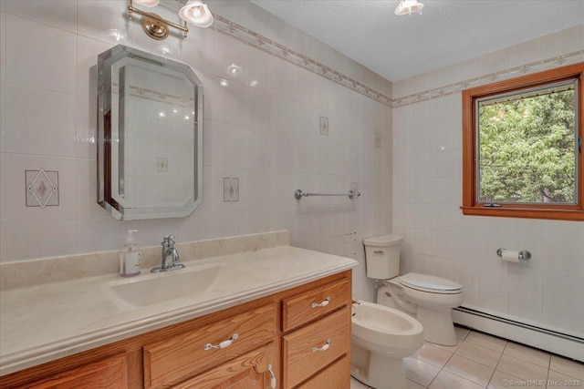101 Langford Ln, East Hartford, CT 06118 - bathroom with tile walls, baseboard heating, vanity, toilet, and tile patterned flooring