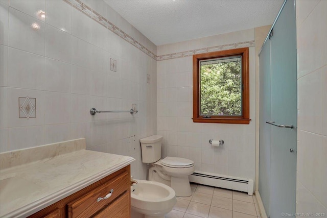 101 Langford Ln, East Hartford, CT 06118 - full bathroom featuring baseboard heating, tile walls, tile patterned floors, vanity, and a bidet