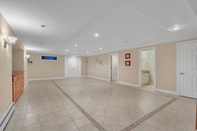 101 Langford Ln, East Hartford, CT 06118 - unfurnished living room with baseboard heating, recessed lighting, baseboards, inlaid floor details, and light tile patterned floors
