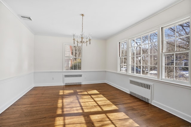 unfurnished dining area with radiator heating unit, a chandelier, and dark hardwood / wood-style flooring