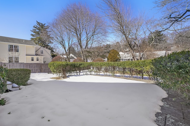 view of yard layered in snow