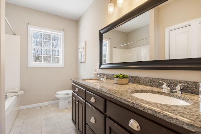 bathroom with baseboards, a shower, toilet, tile patterned flooring, and a sink