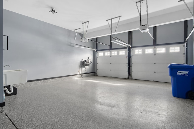 garage featuring baseboards and a garage door opener