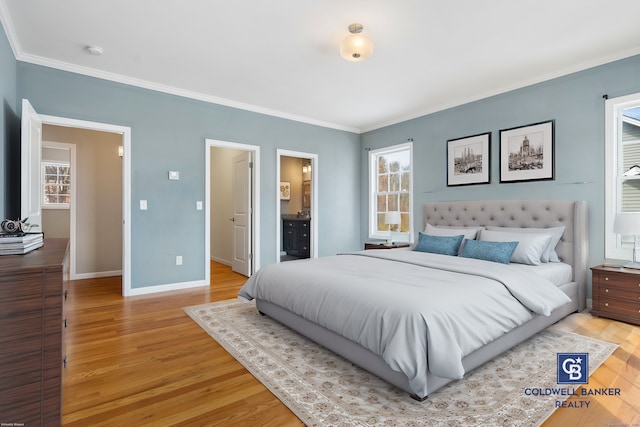 bedroom with crown molding, light wood-type flooring, connected bathroom, and baseboards