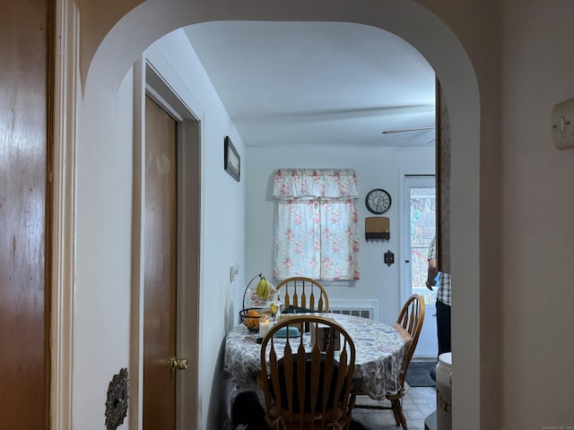 dining room featuring arched walkways