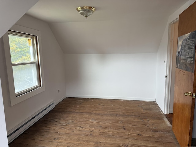 bonus room with baseboards, a baseboard heating unit, vaulted ceiling, and dark wood finished floors