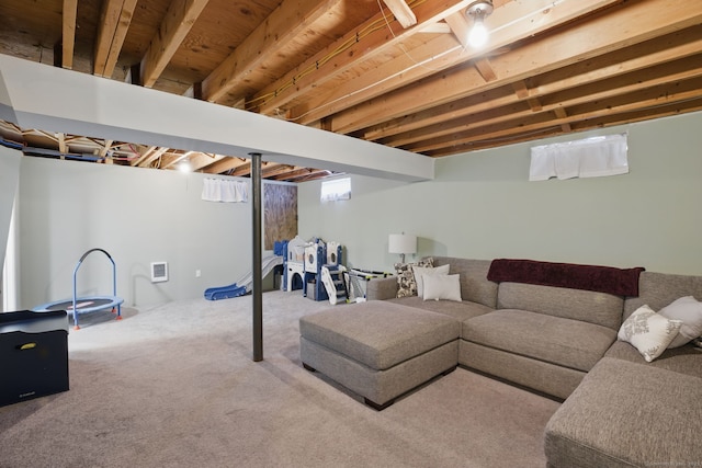 living area featuring carpet floors and plenty of natural light