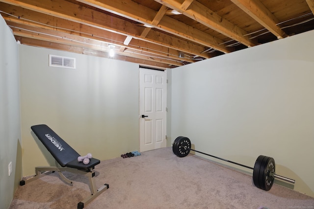 exercise area featuring carpet and visible vents