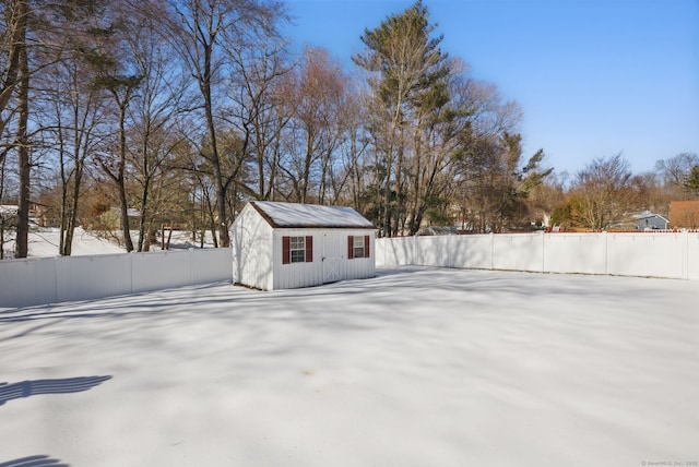 exterior space featuring an outbuilding and fence