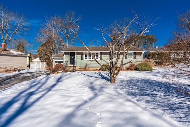 ranch-style home with fence