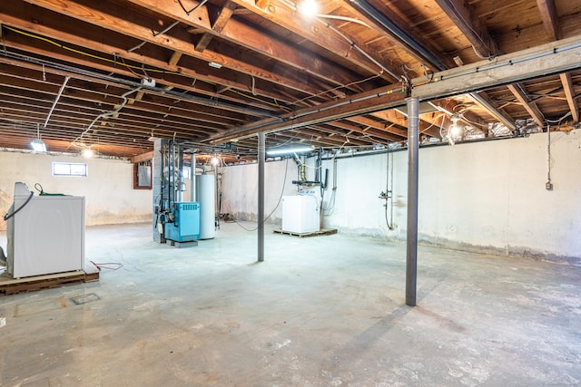 basement featuring washer / dryer and water heater