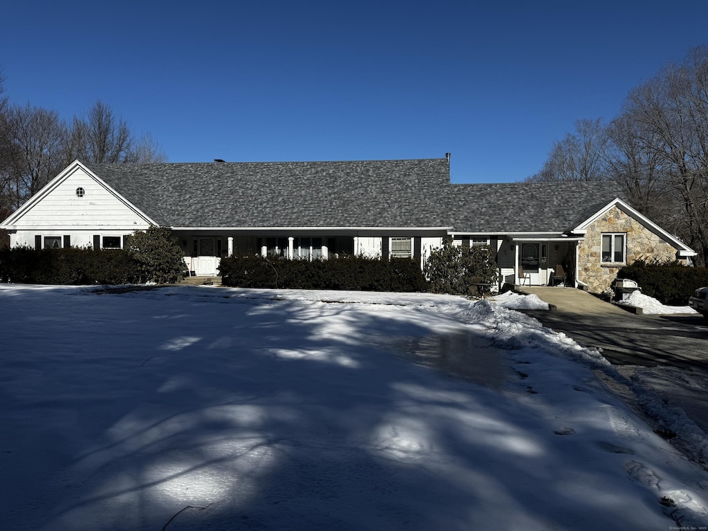 ranch-style house with stone siding