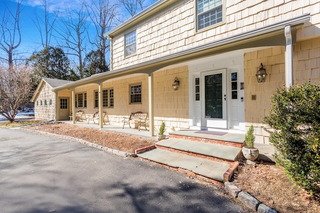 property entrance featuring covered porch