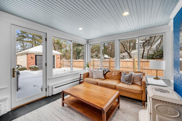 sunroom / solarium featuring baseboard heating