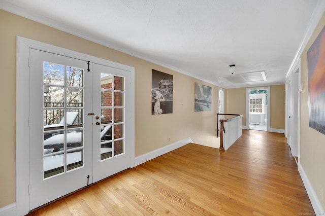 interior space with french doors, light wood-style flooring, and baseboards