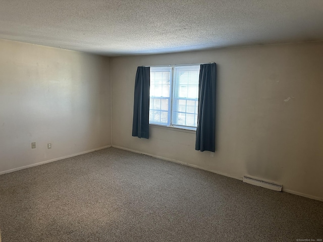 carpeted spare room with visible vents and a textured ceiling