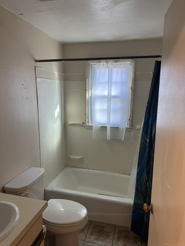 full bath featuring toilet, shower / tub combo with curtain, and vanity