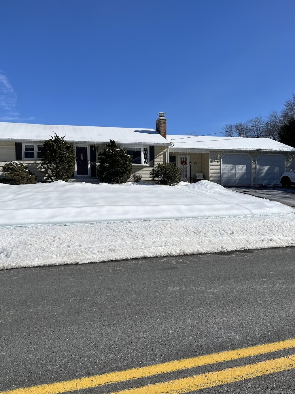 35 Steele Rd, Enfield, CT 06082 - ranch-style home with a garage and a chimney