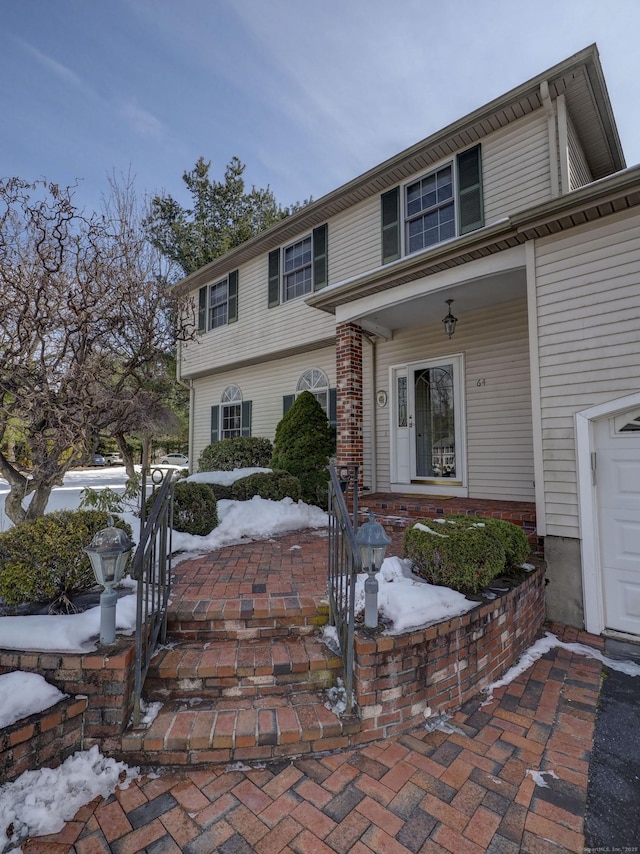 view of front facade featuring brick siding