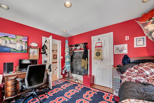 home office with wood finished floors