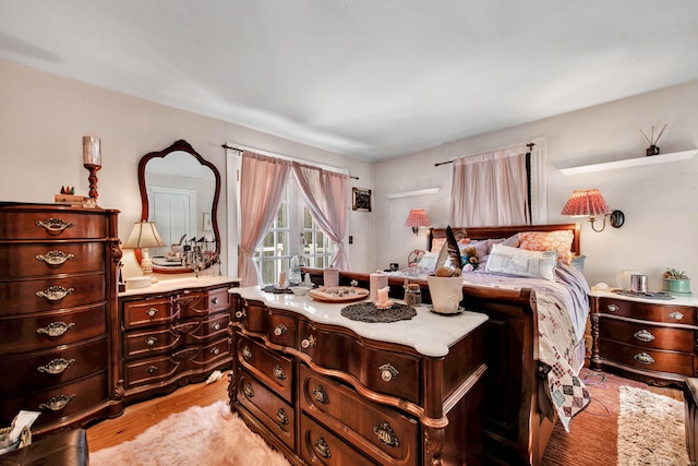 bedroom featuring light wood-style floors