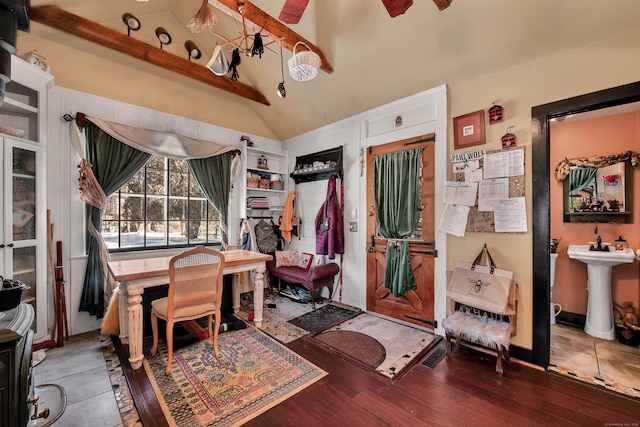 dining area with wood finished floors and vaulted ceiling