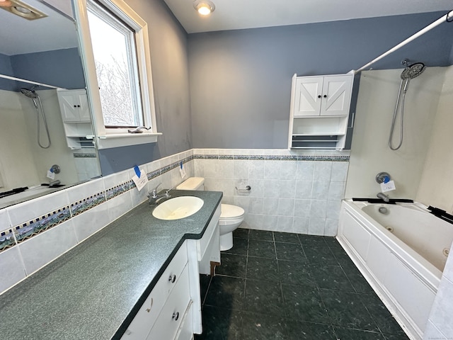 159 Tom Swamp Rd, Hamden, CT 06518 - bathroom featuring toilet, vanity, bathing tub / shower combination, tile walls, and wainscoting