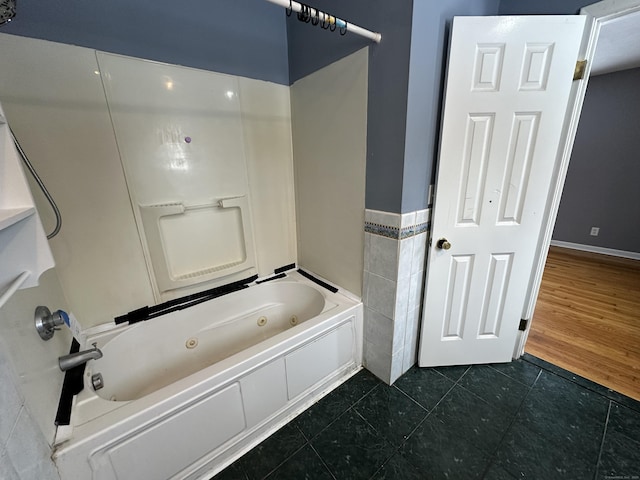 159 Tom Swamp Rd, Hamden, CT 06518 - full bath with a combined bath / shower with jetted tub, tile patterned flooring, tile walls, and wainscoting