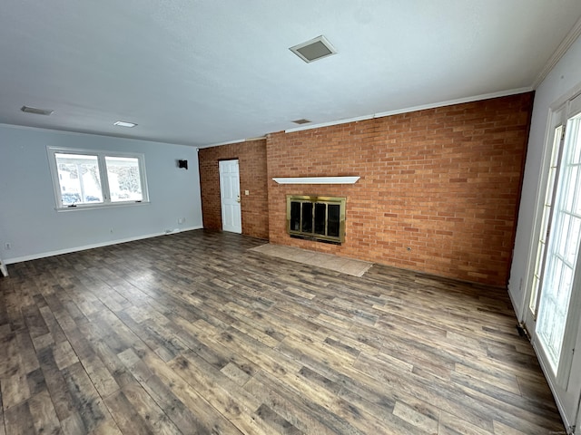 159 Tom Swamp Rd, Hamden, CT 06518 - unfurnished living room featuring a fireplace, visible vents, dark wood-type flooring, ornamental molding, and brick wall