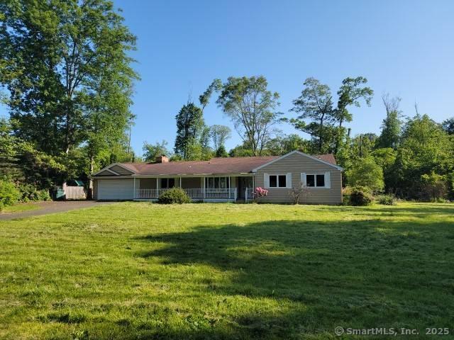 159 Tom Swamp Rd, Hamden, CT 06518 - ranch-style house featuring an attached garage, a front yard, asphalt driveway, covered porch, and a chimney