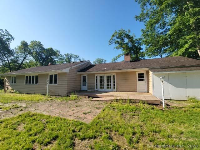 159 Tom Swamp Rd, Hamden, CT 06518 - rear view of house featuring french doors, a chimney, and a patio area