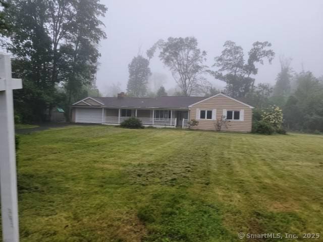 159 Tom Swamp Rd, Hamden, CT 06518 - ranch-style home featuring a porch, a front lawn, and a chimney