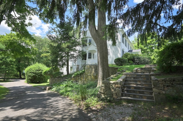 view of property exterior with stairway