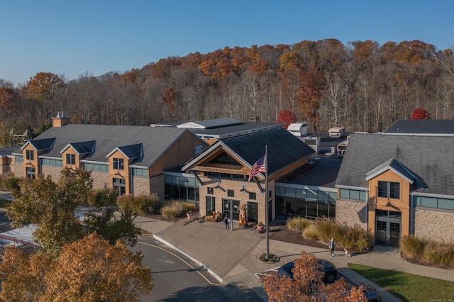 view of building exterior featuring a wooded view