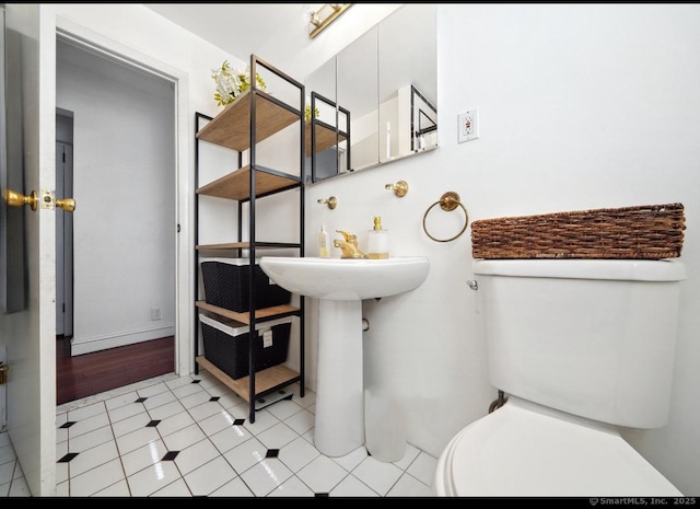 bathroom featuring tile patterned floors and toilet