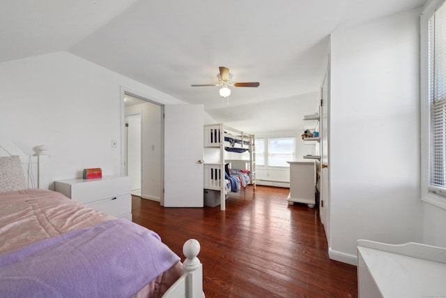 bedroom with a baseboard heating unit, baseboards, dark wood-type flooring, ceiling fan, and lofted ceiling