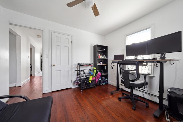 office space featuring a wealth of natural light, baseboards, a ceiling fan, and hardwood / wood-style flooring