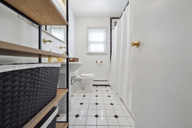 full bathroom featuring toilet and a baseboard radiator