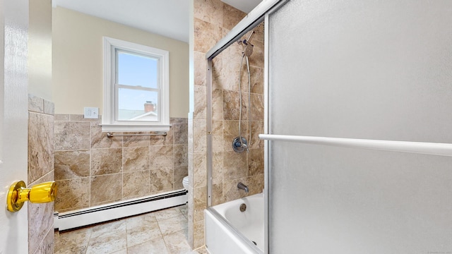 bathroom featuring tile walls, toilet, a baseboard heating unit, enclosed tub / shower combo, and tile patterned floors