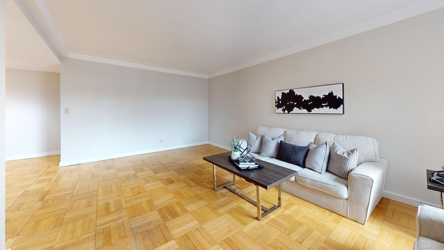 living area with ornamental molding and baseboards