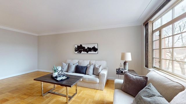 living room featuring crown molding and baseboards