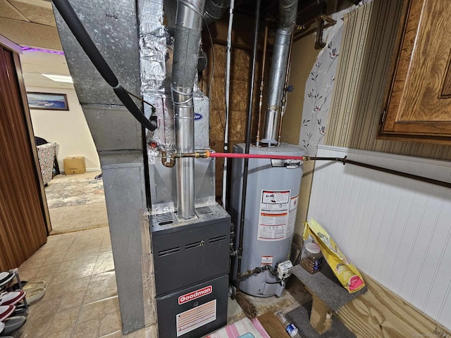 utility room featuring gas water heater